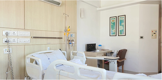 Empty hospital bed in a medical room, representing unused patient capacity.
