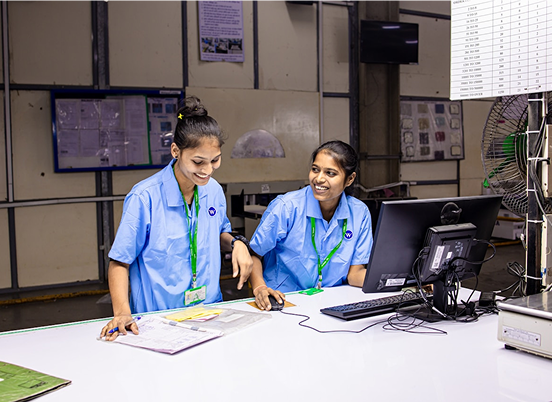Staff reviewing referrals at a workstation to streamline admissions workflows