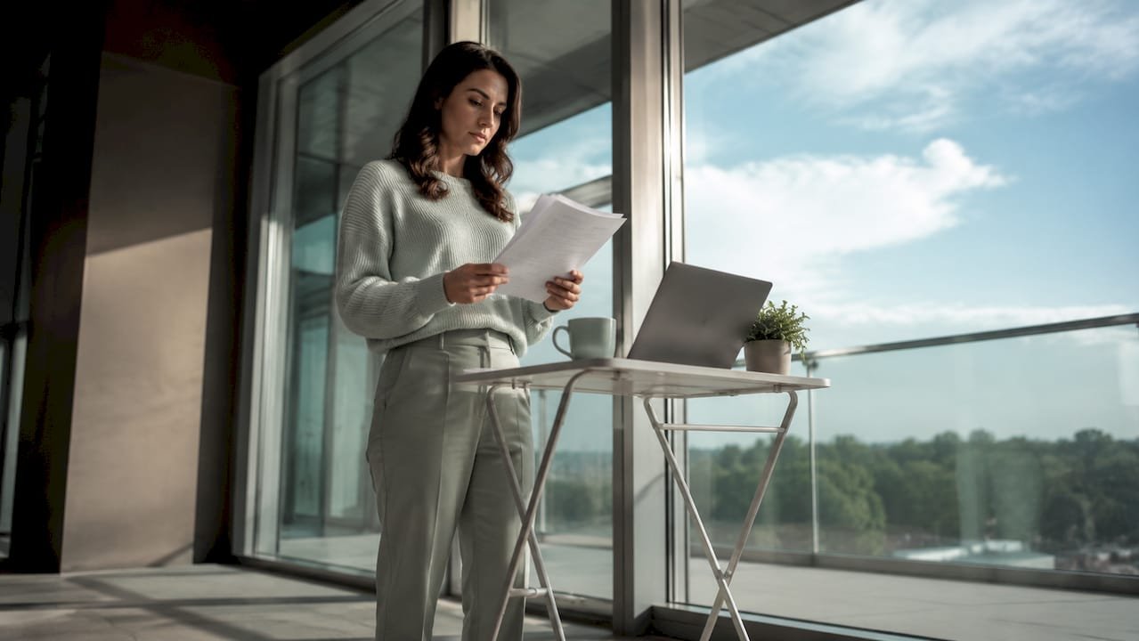 Referral coordinator managing patient referrals at desk
