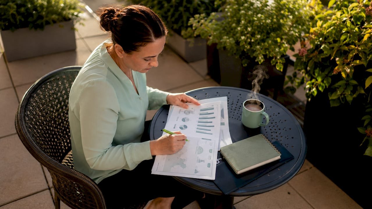 Healthcare manager reviewing intake volume reports